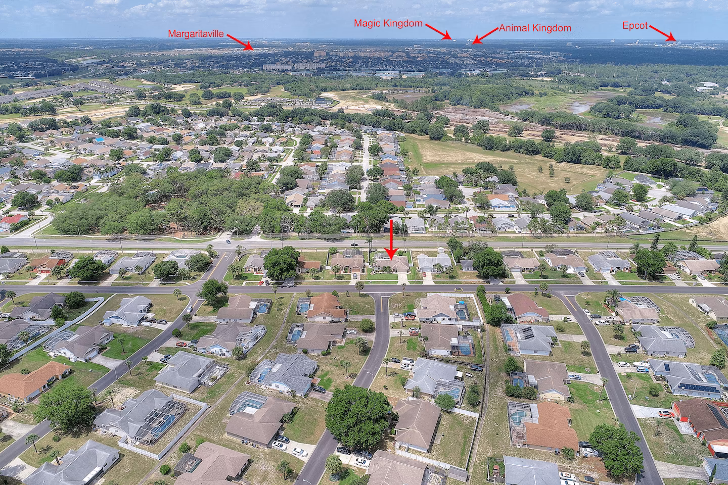 Aerial view of Indian Ridge showing The Indian Retreat villa (red arrow) with Margaritaville, Magic Kingdom, Animal Kingdom and Epcot visible on the horizon
