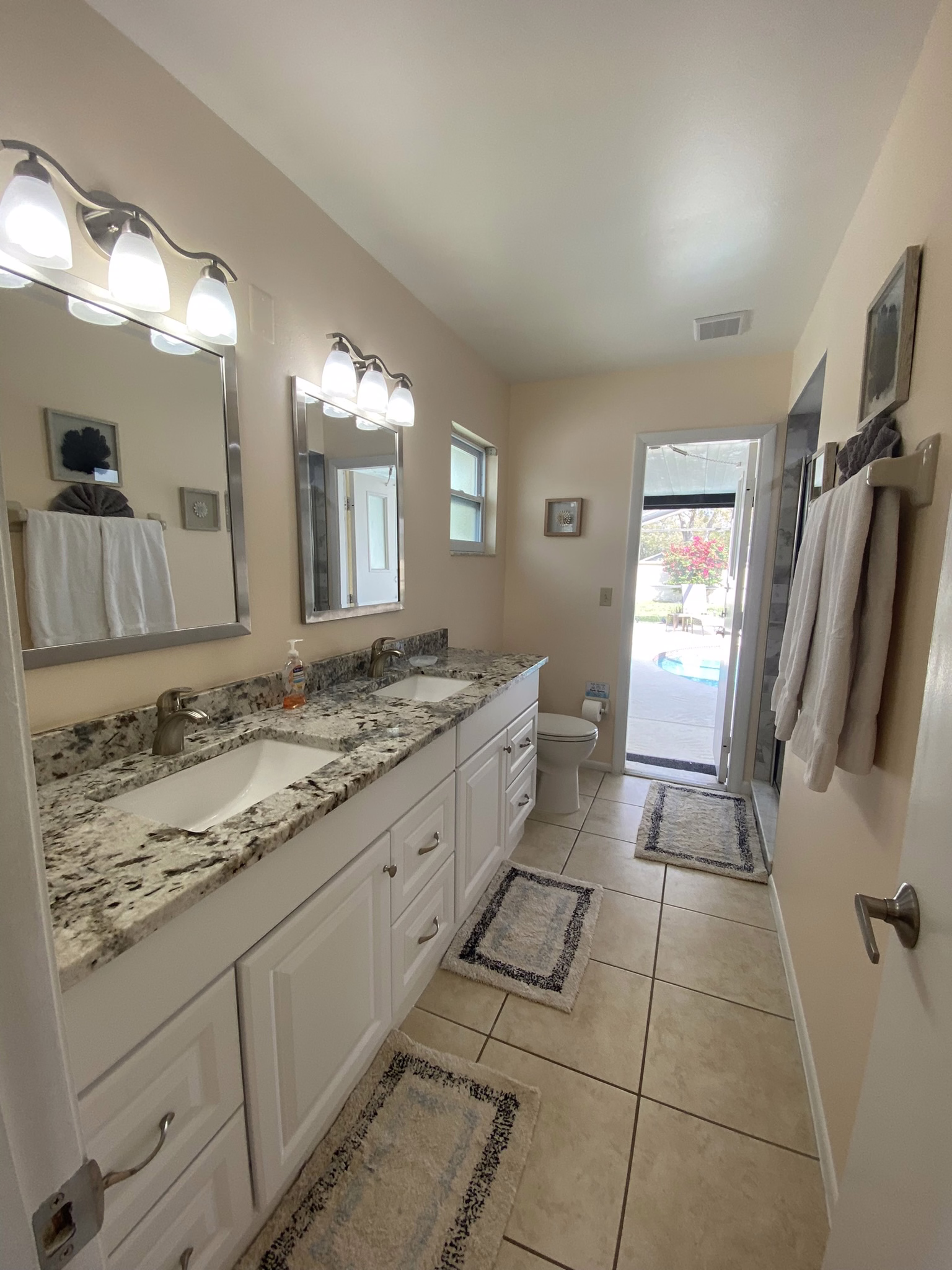 En-suite double vanity with pool access door