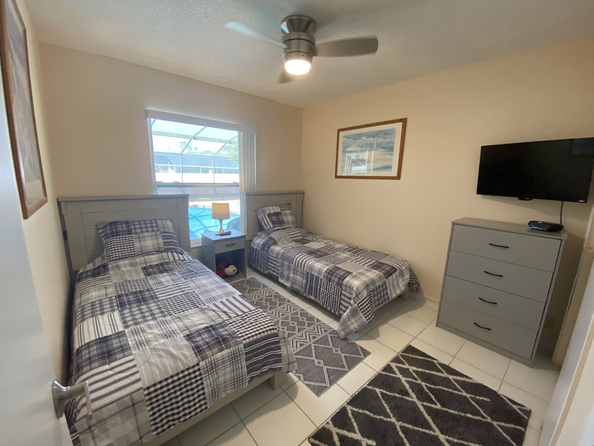 Twin bedroom with pool view window